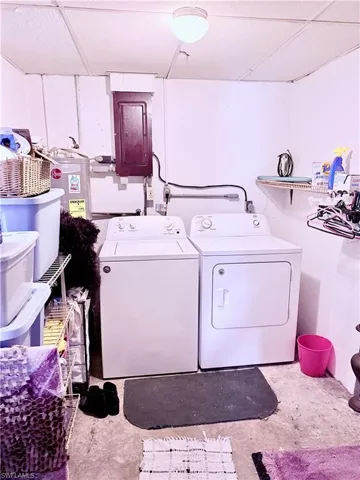 Laundry room with separate washer and dryer and electric panel