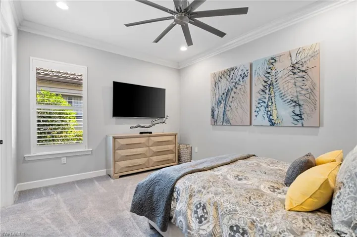 Bedroom with crown molding, carpet floors, a ceiling fan, and recessed lighting