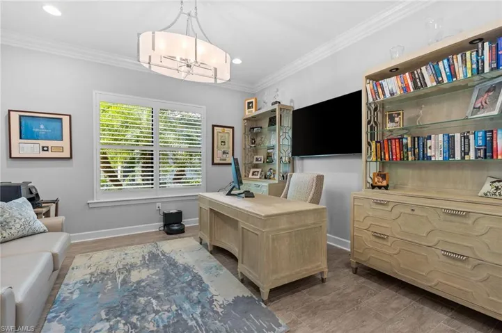 Office featuring ornamental molding and recessed lighting