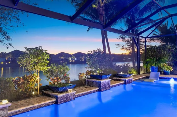 Pool at dusk featuring an outdoor pool and a patio area