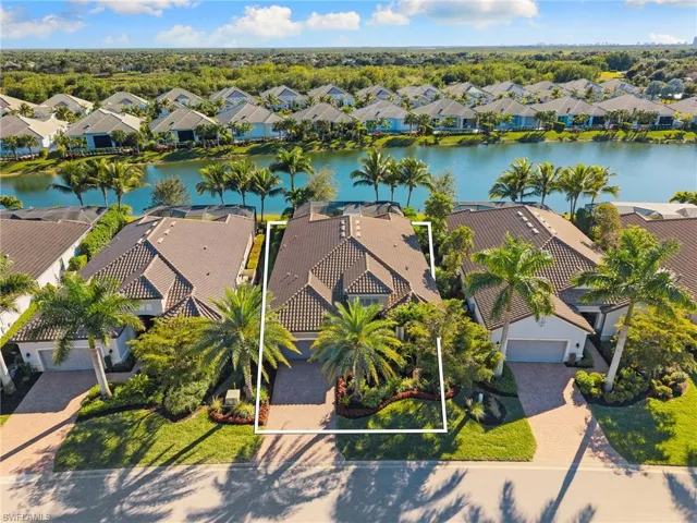 Aerial perspective of suburban area with a large body of water