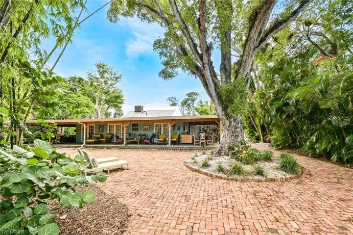 View of veranda and mahogany tree