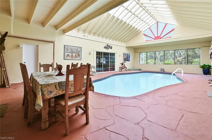 Pool area with vaulted ceilings