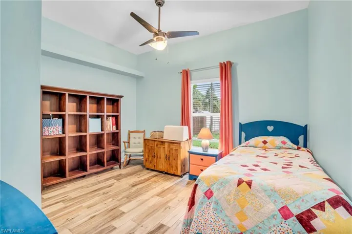 Bedroom featuring hardwood / wood-style flooring and ceiling fan