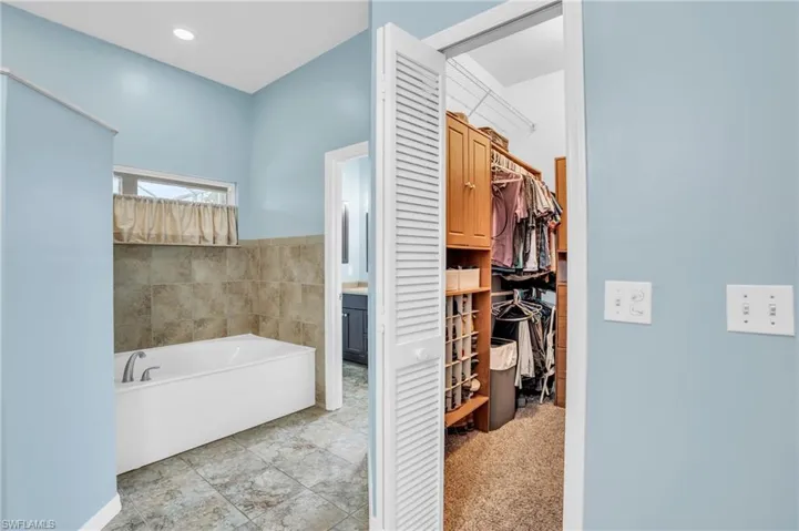 Bathroom featuring a bathing tub and tile patterned floors