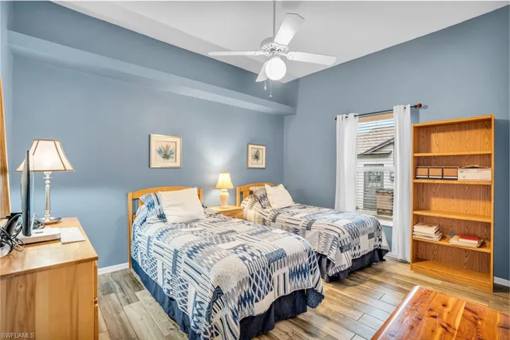 Bedroom featuring light hardwood / wood-style flooring and ceiling fan