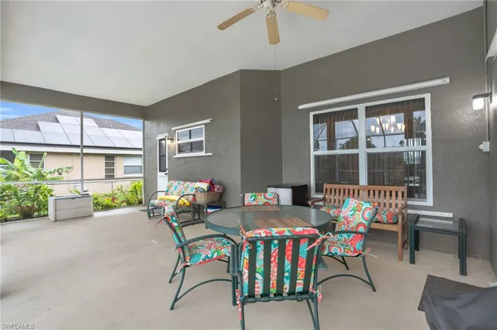 View of patio featuring ceiling fan