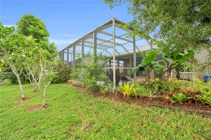 View of yard with a lanai