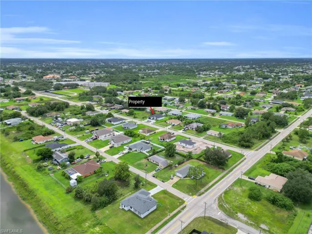 View of property location with nearby suburban area