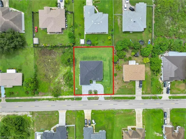 Aerial perspective of suburban area with property parcel outlined