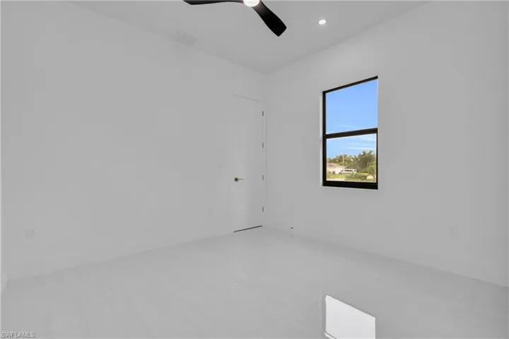 Spare room with recessed lighting and a ceiling fan