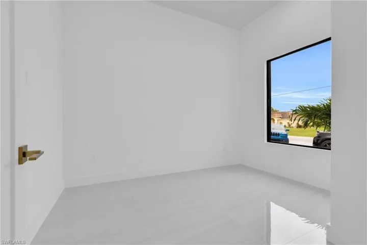 Spare room featuring baseboards