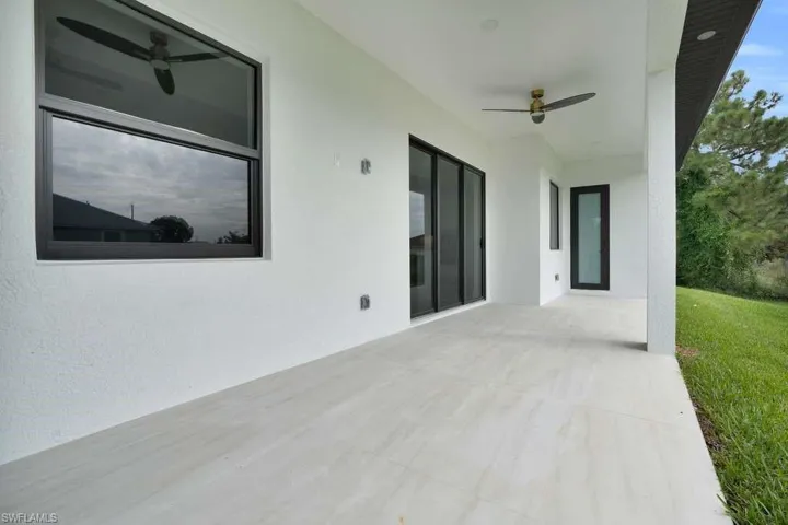 View of patio featuring ceiling fan