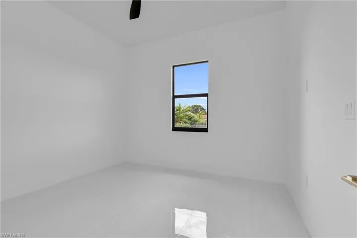 Empty room featuring baseboards