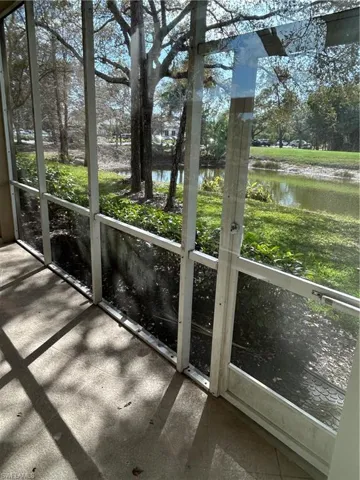Unfurnished sunroom with a water view and plenty of natural light
