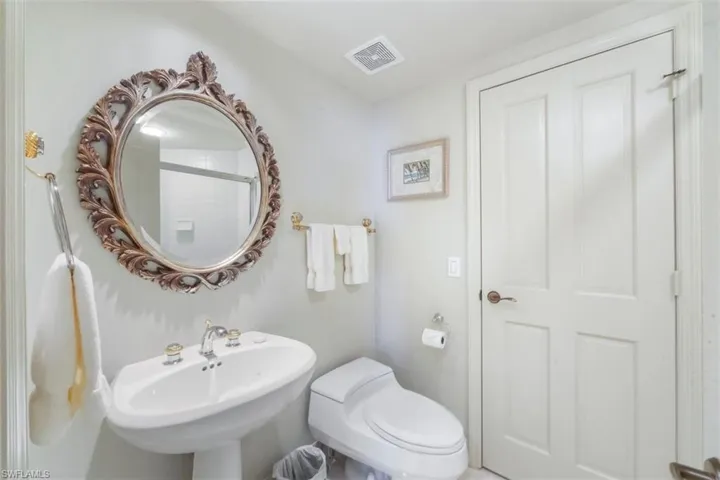 Bathroom with toilet and an enclosed shower