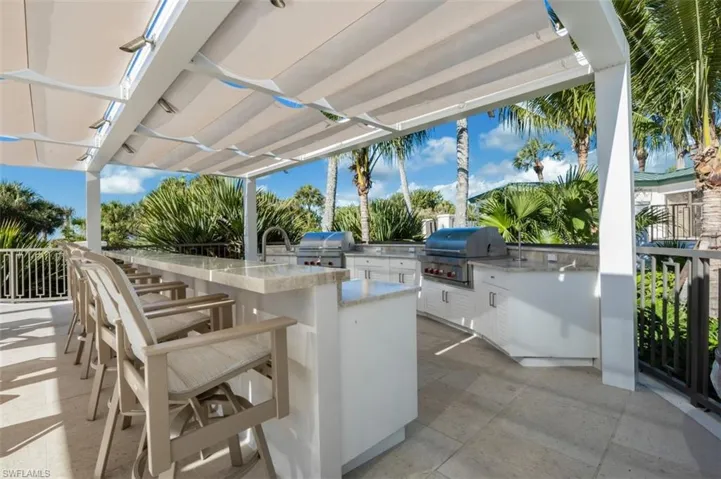 View of patio featuring exterior kitchen