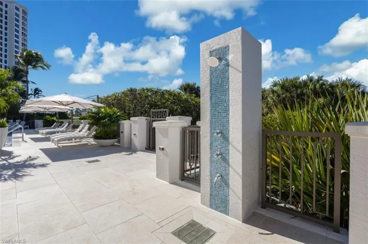 View of patio featuring a gate