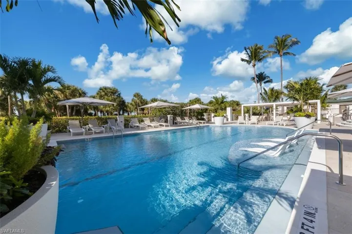 Community pool with a patio