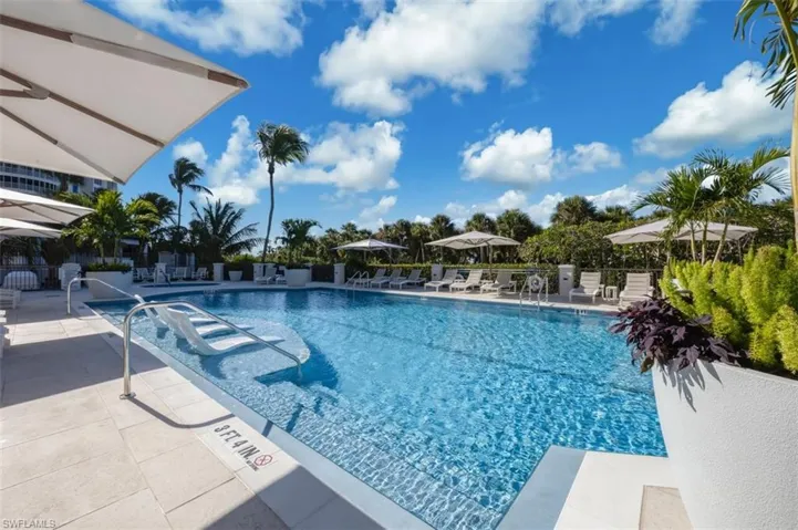 Community pool featuring a patio