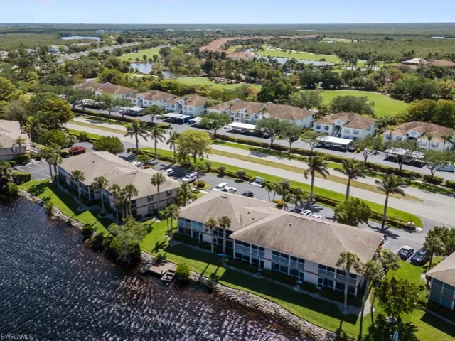 Aerial view featuring a water view and a residential view