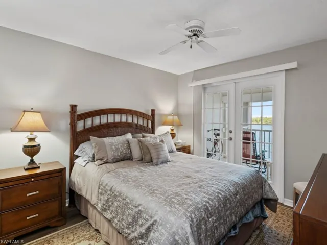 Bedroom featuring ceiling fan, french doors, access to outside, and wood finished floors