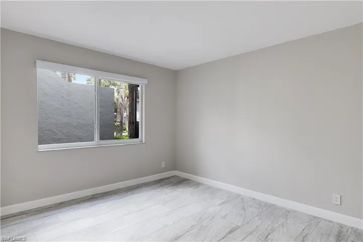 Spare room with light wood-type flooring