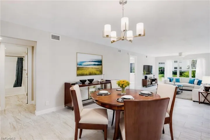 Dining area featuring an inviting chandelier