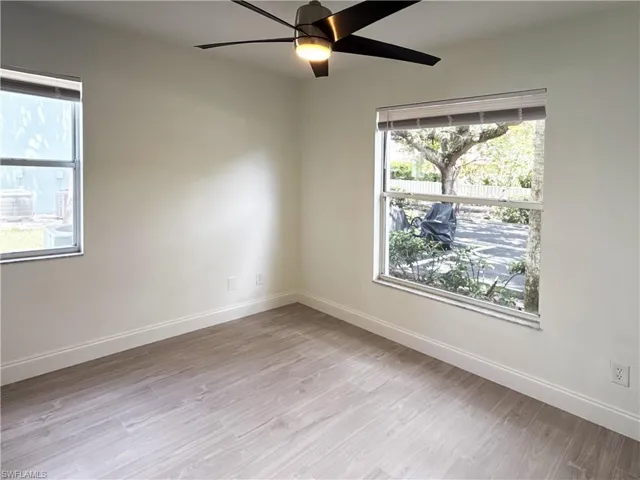 Guest Room featuring modern tile flooring, an extra side window and updated fan.