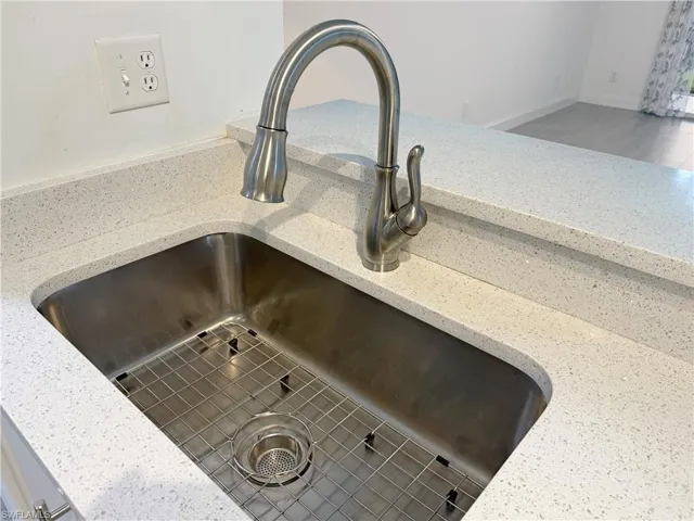 Modern, kitchen faucet with extra wide S/S sink