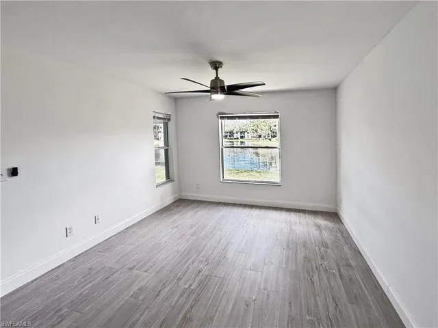 Owner's suite featuring tile flooring and lake view.  Extra windows allows for cross ventilatio