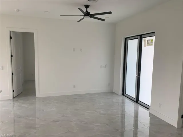 Living area, front door + master bedroom entrance