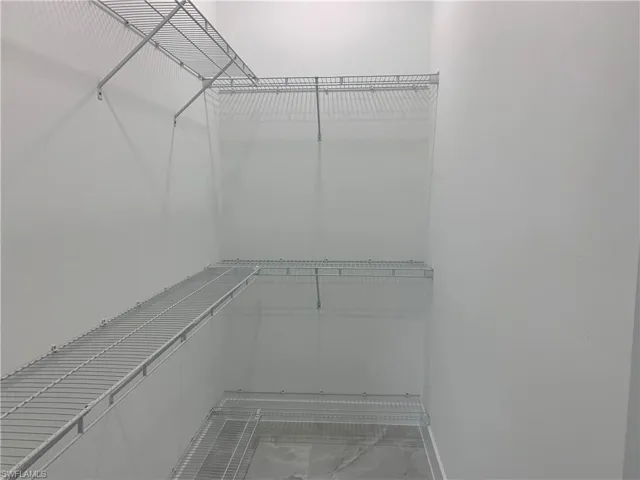 Master bedroom closet with custom shelving