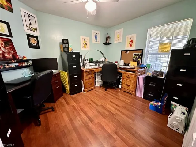 Office area featuring light hardwood / wood-style floors and ceiling fan
