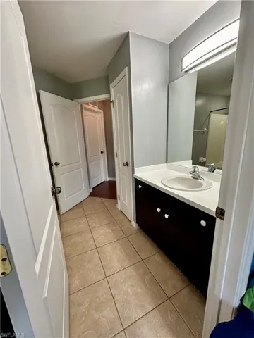 Bathroom featuring tile patterned floors and vanity