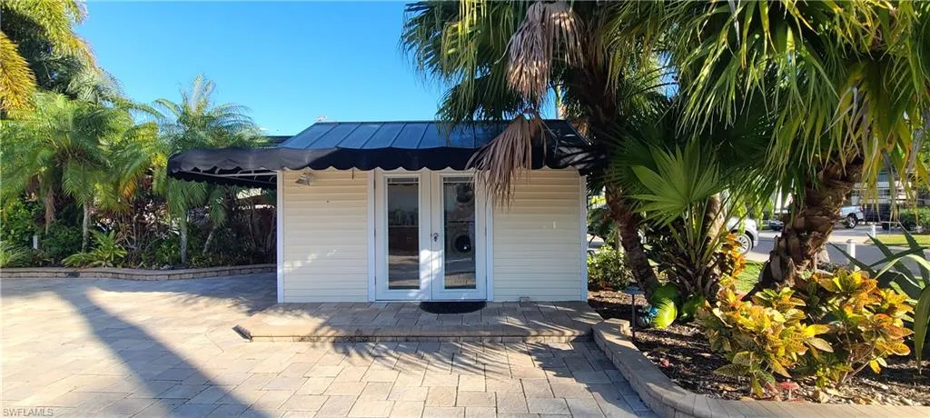 View of outbuilding featuring french doors