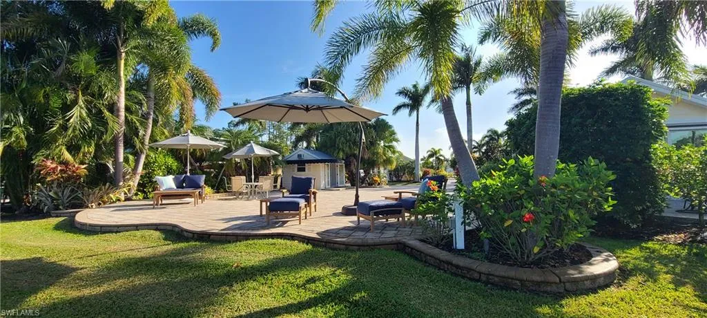 Surrounding community featuring a yard and a patio
