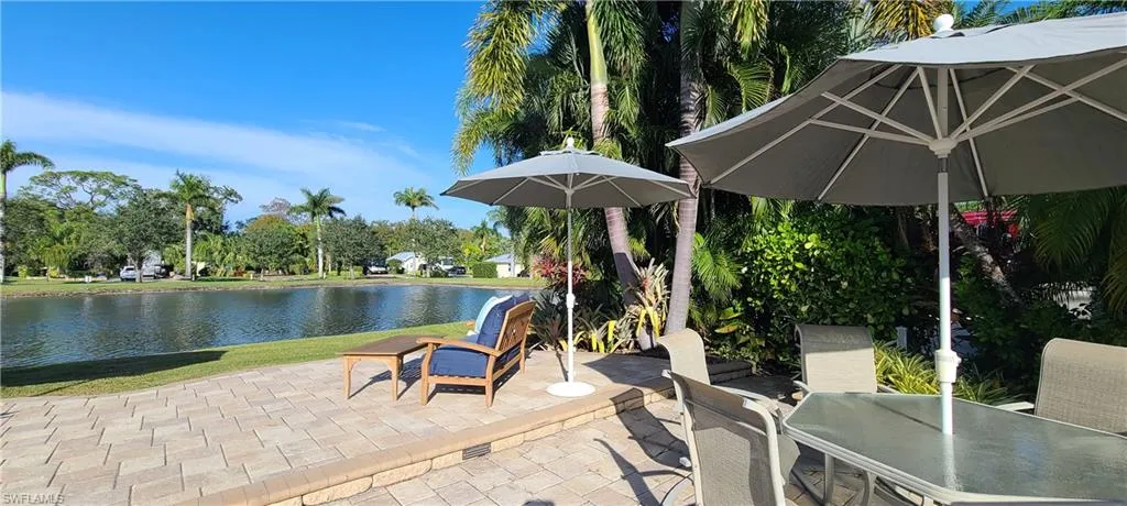 View of patio with a water view