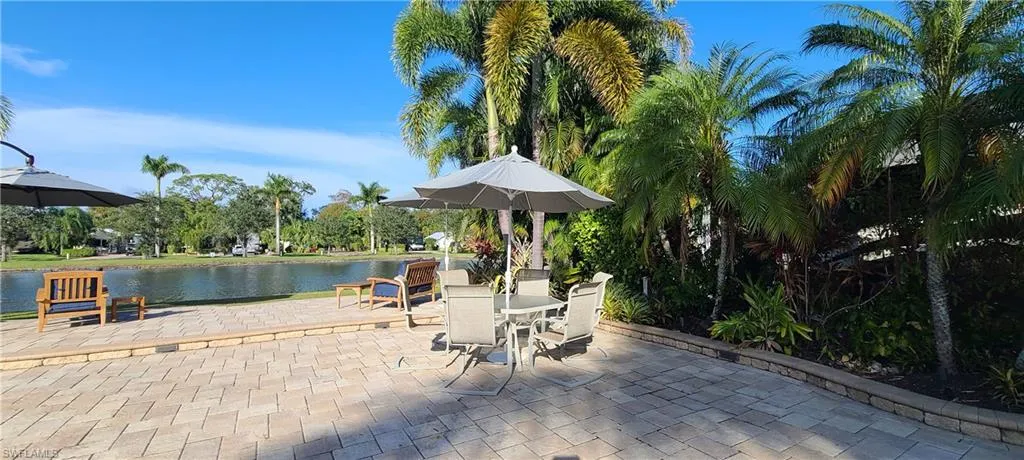 View of patio / terrace with a water view