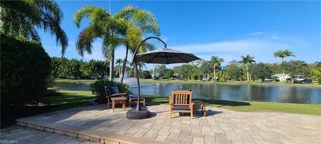 View of patio with a water view