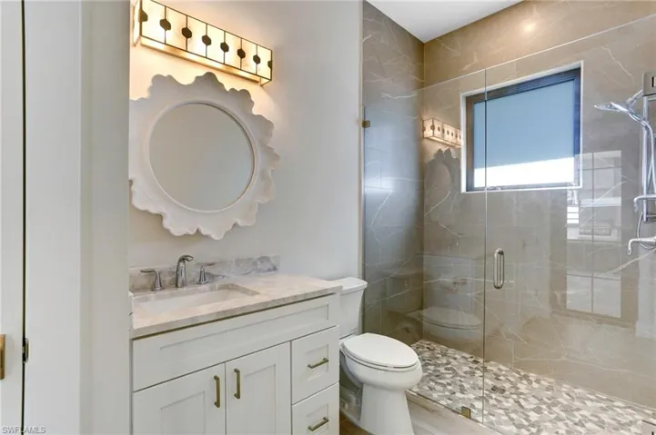 Ensuite bathroom four doubles as a pool bath with exterior door leading to the pool