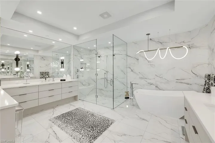 Luxurious walk-in shower and soaking tub for ultimate relaxation.