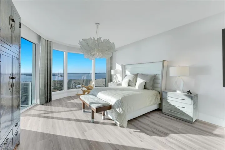 Elegant primary bedroom with designer finishes and warm natural tones. And the VIEW!