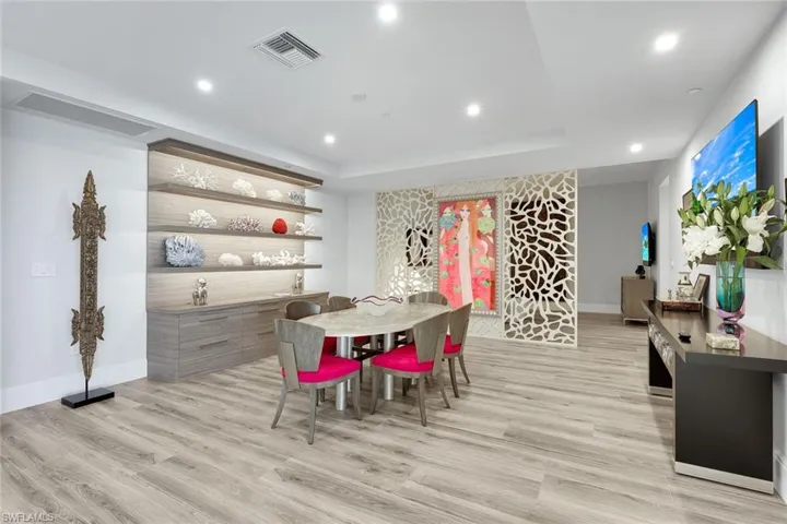 This area features a custom-designed architectural screen, offering definition and privacy without sacrificing the home’s open, modern aesthetic.