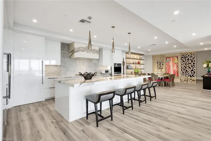 The SPECTACULAR kitchen is where guests naturally gather; this home’s design intentionally invites connection.
