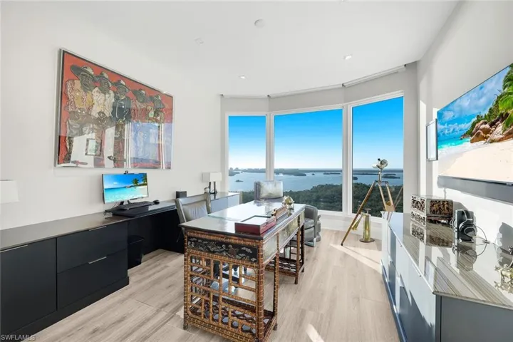 This light-filled room functions seamlessly as a home office or additional bedroom.