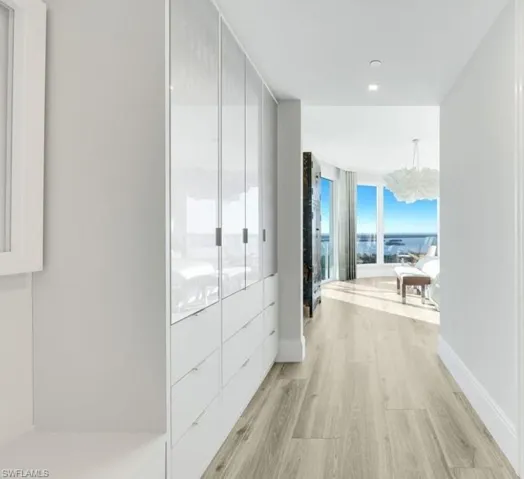 Custom built-in shelving designed to complement the generous walk-in closet.