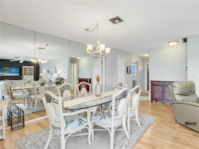 Dining space featuring a chandelier and light wood-style floors