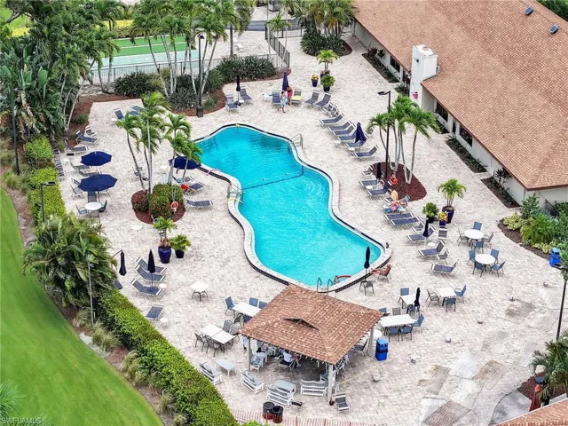 Community pool featuring a pergola