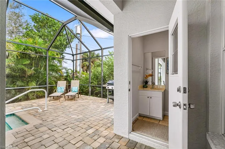 Unfurnished sunroom with sink